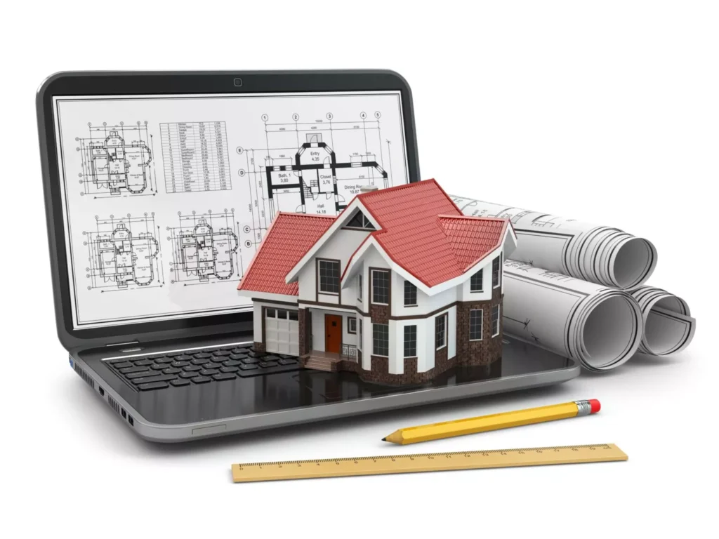 A laptop displaying architectural blueprints with a miniature house model on top, alongside rolled construction plans, a pencil, and a ruler, representing commercial construction estimating services.