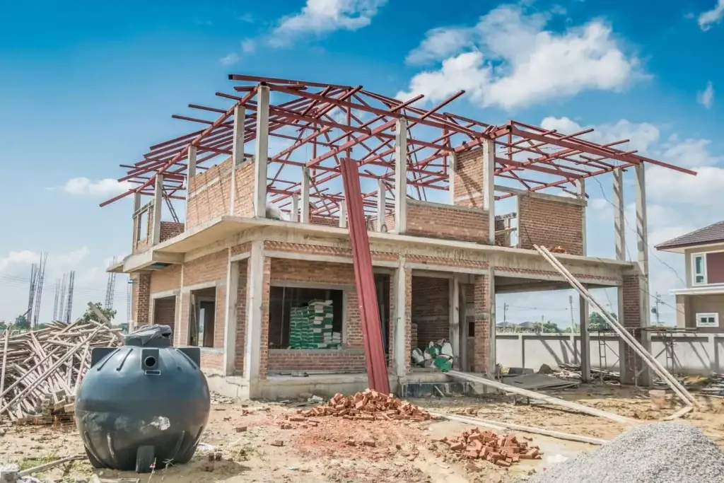 Construction site showing brick and concrete work, representing concrete estimating services.